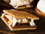Homemade S'more with chocolate and marshmallow on a graham cracker